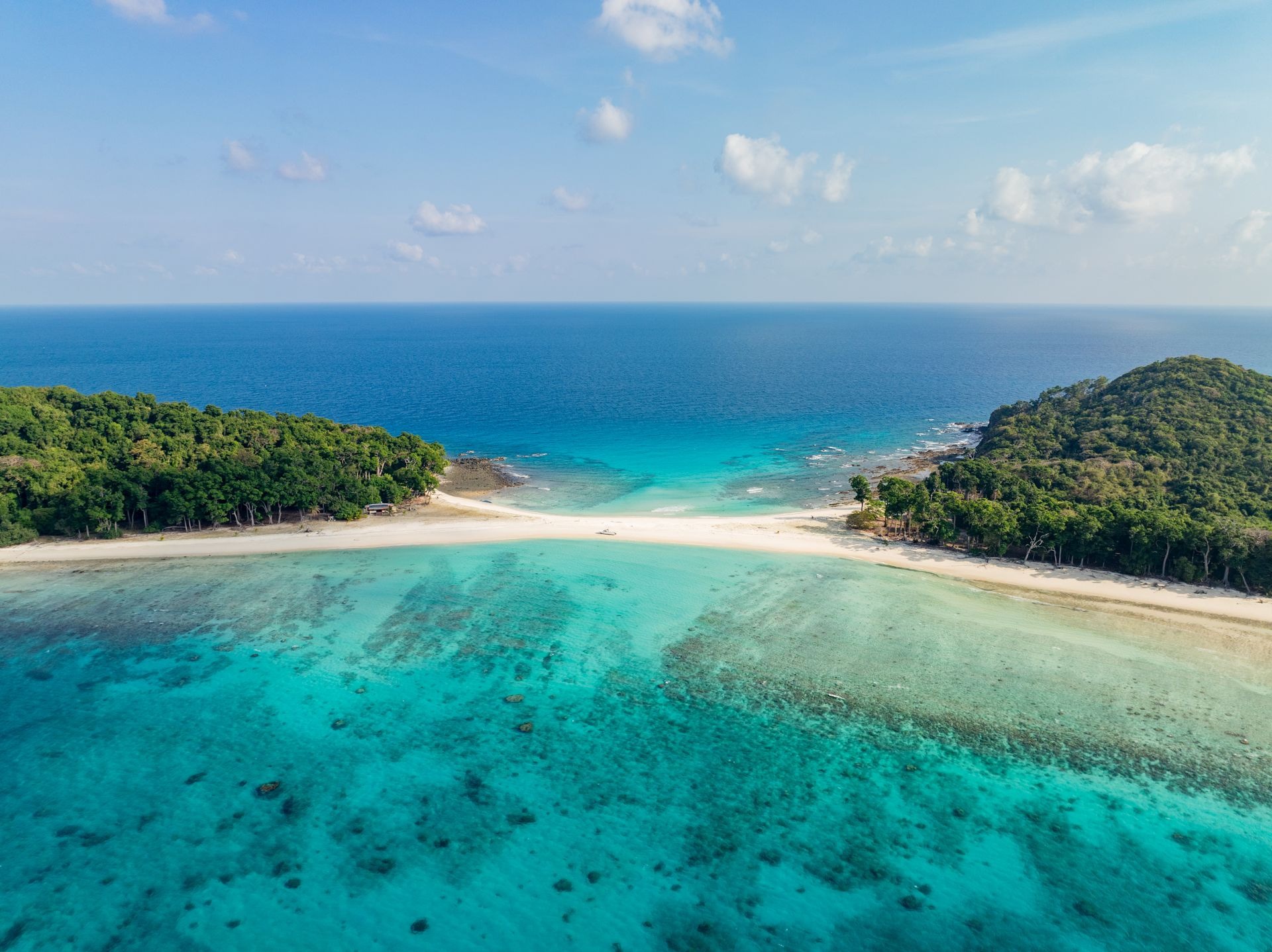 Snorkeling crystalline waters over pristine coral gardens